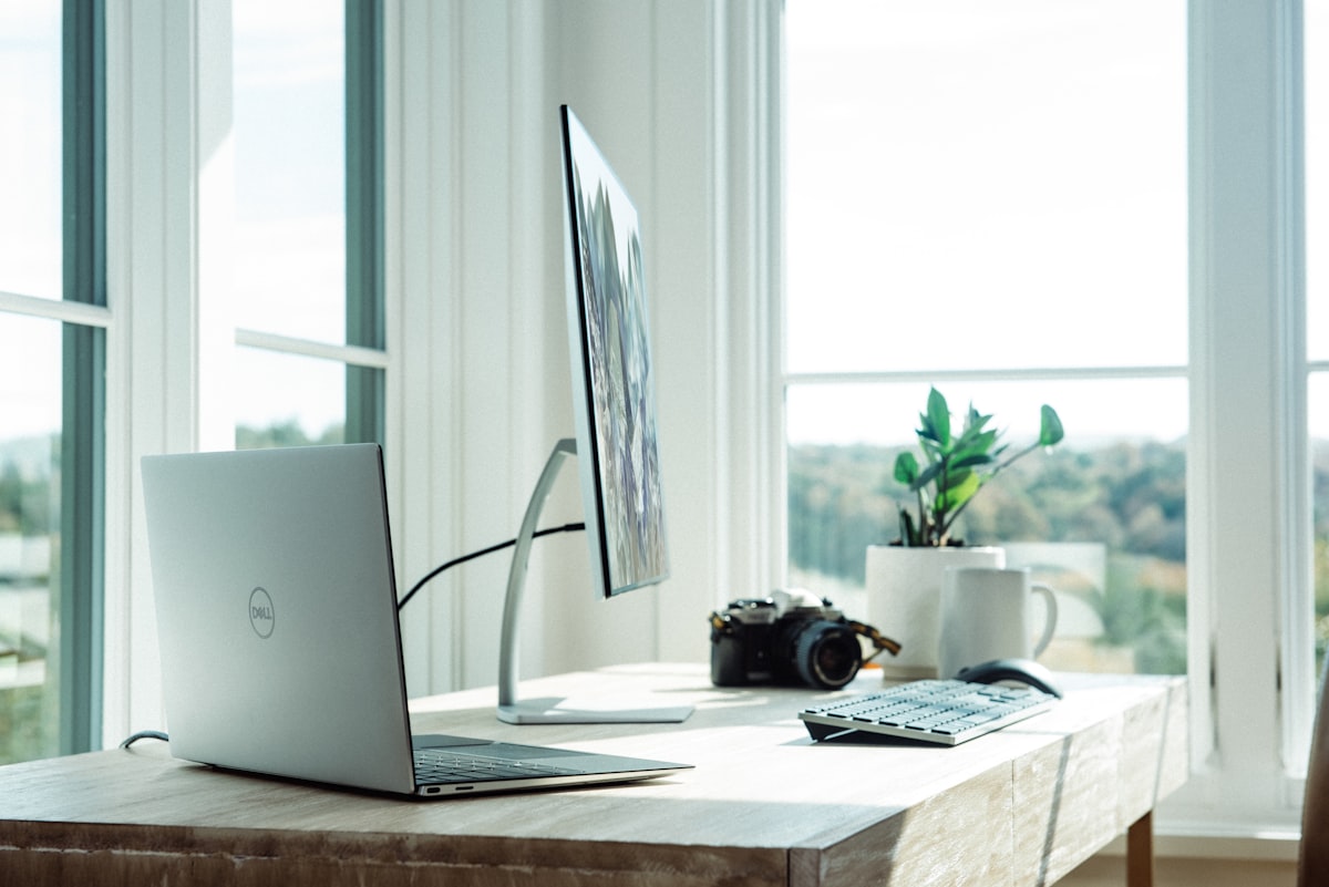 Modern workspace with laptop and desktop